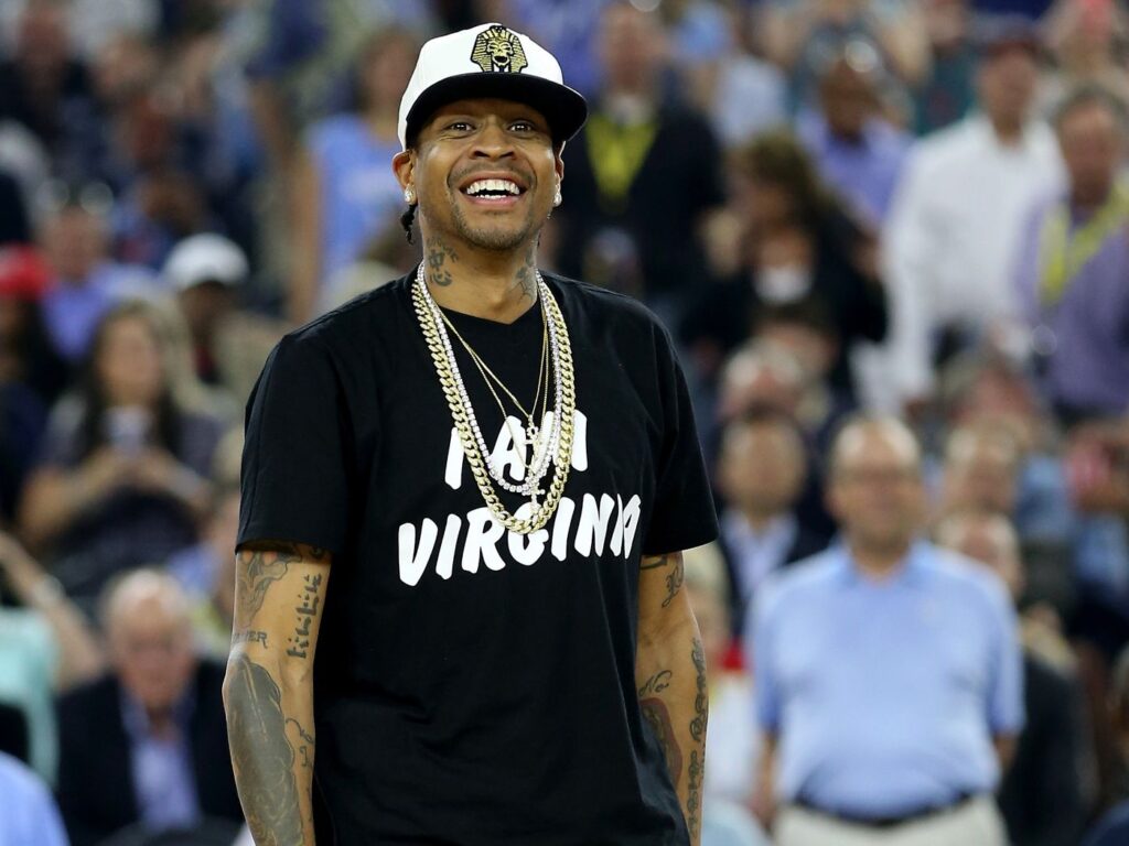 photo of Allen Iverson wearing "I am Virginia" t-shirt in front of a crowd