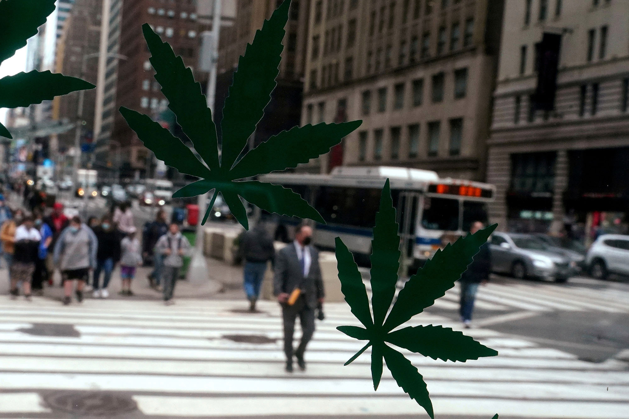 Cannabis stickers on a Weed World store window are pictured the day New York State legalized recreational marijuana use amid the coronavirus disease (COVID-19) pandemic in the Manhattan borough of New York City, New York, U.S., March 31, 2021.