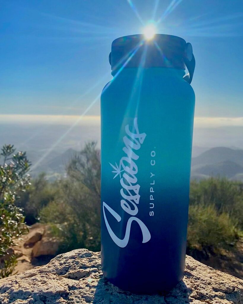 photo of Sessions water bottle in front of scenic mountain background