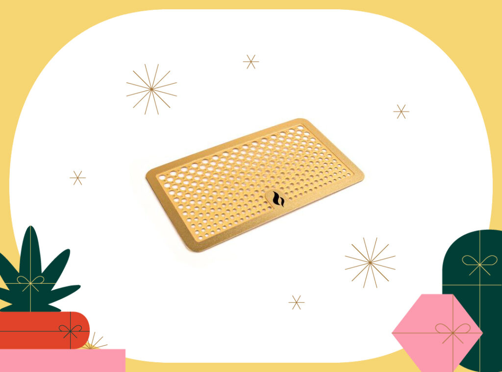 photo of TrueToke gold grinder card on holiday background