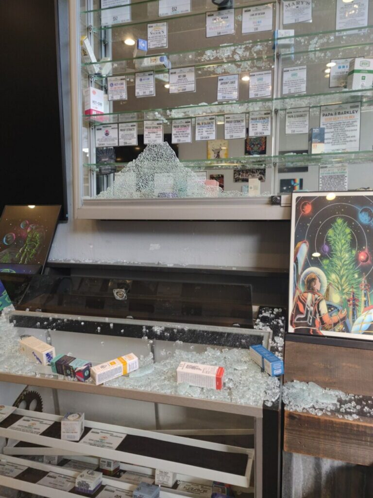 A smashed glass display case from Organicann in Oakland, one of 25 burglary victims in an ongoing crime wave in Oakland.