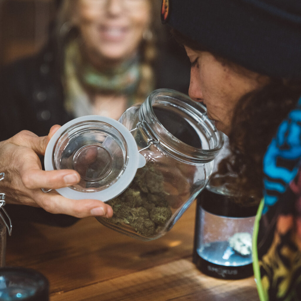 A man sniffs a jar of herb at The Emerald Cup 2021. (Photo by Dany Olsan, Courtesy The Emerald Cup)