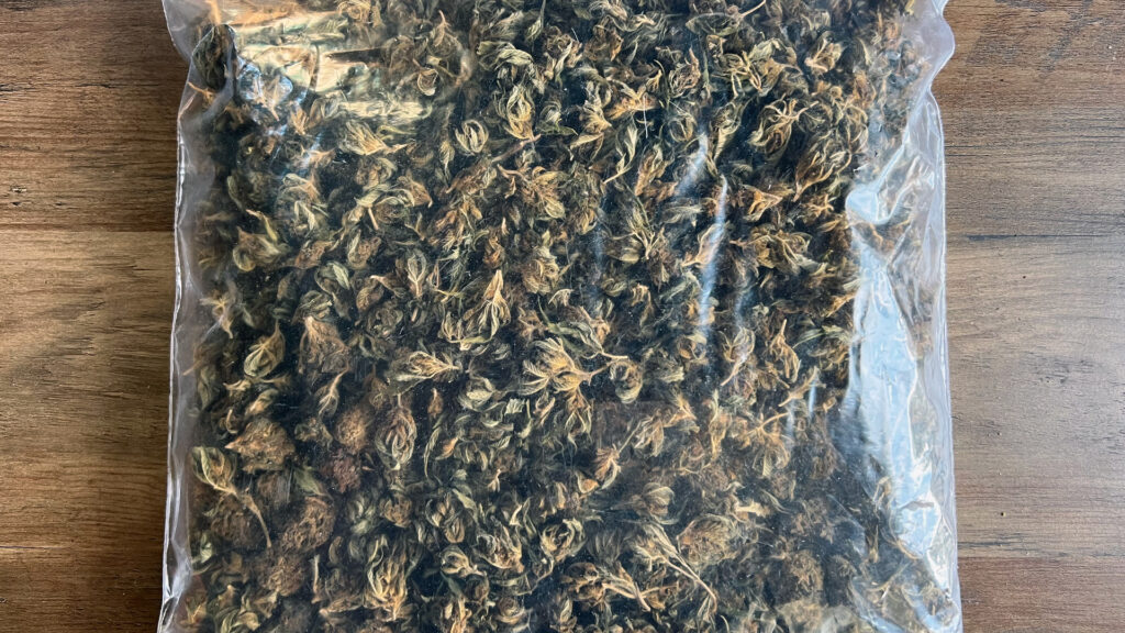 A bag of decarbed nugs on a wooden background