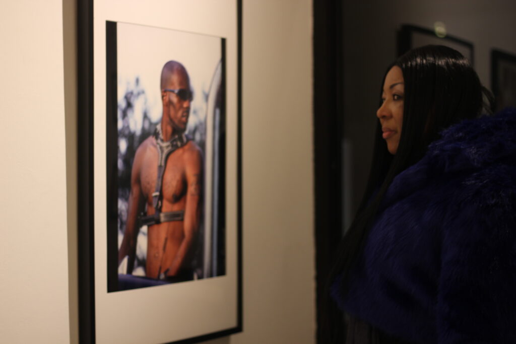 At Legacy NYC art gallery, a local woman views art from Sue Kwon's art book, Rap Is Risen. (Leafly / Megan Schmidt)