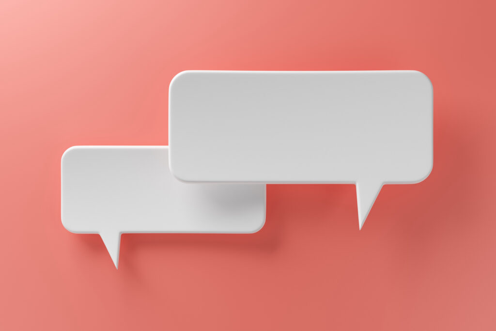 two white speech bubbles on orange background. 3D rendering