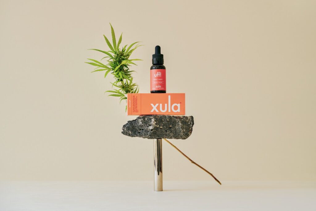Xula products with natural props on tan background
