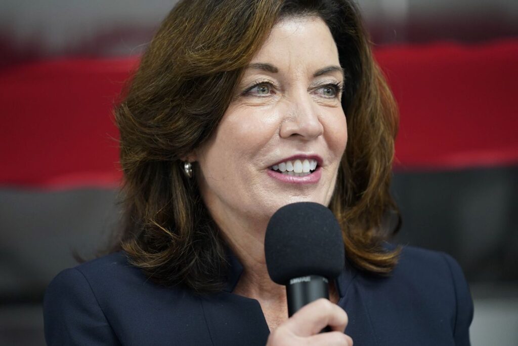 photograph of New York Governor Kathy Hochul holding a microphone