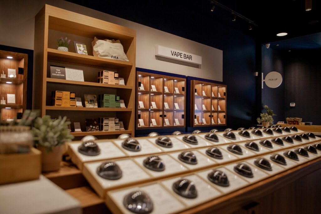 pot shop interior with flower samples displayed on a table in fist sized glass globes built into the table